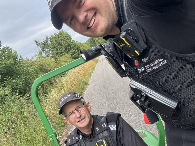Officers aboard the recovered mower. Photo: LRCAT