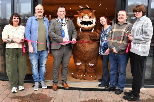 Coun Matt Boles with the Gruffalo and the Waterstones team