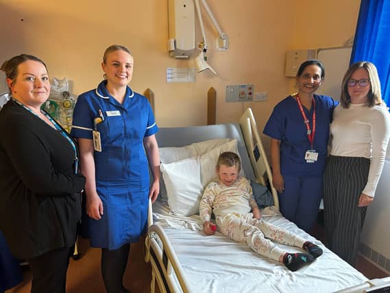 Staff from the Paediatric Pre-Operative Service (from left) Administration Assistant Joanne Murray, Deputy Sister Lauren Patel, Consultant Anaesthetist Pramila Vadde and Clinical Service Manager Lizzie Saxby, with patient Jaxson on Rainforest Ward at Lincoln County Hospital.