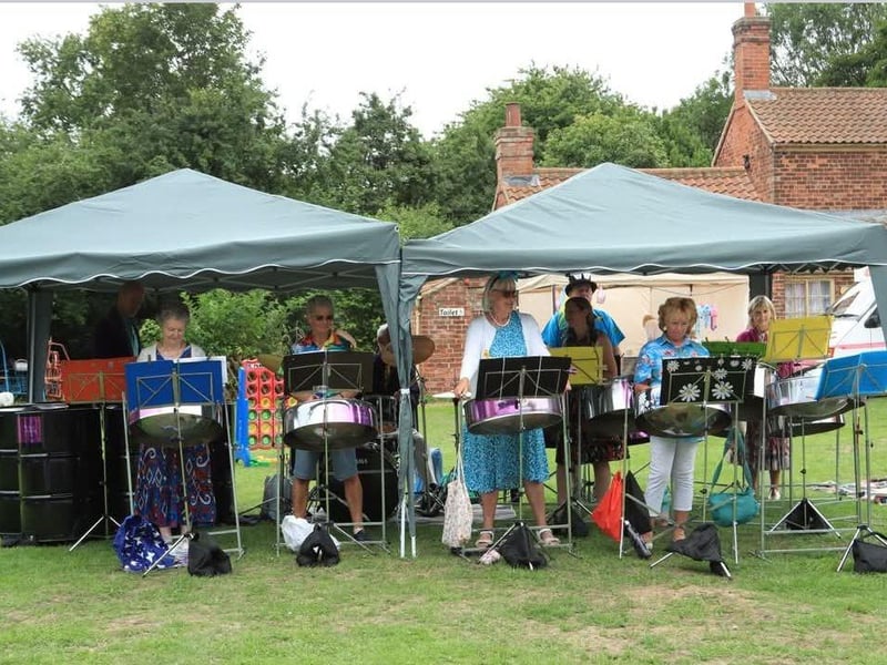 Charlotte and Rhythm and Steel Band from Alford performing Caribbean themed Alice in wonderland Music