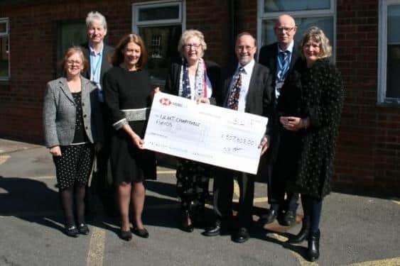 Trevor Marris (third from right), chairman of the Louth Scanner Appeal, presents a cheque for £507,608 to hospital representatives in 2019 after the successful fundraising appeal.
