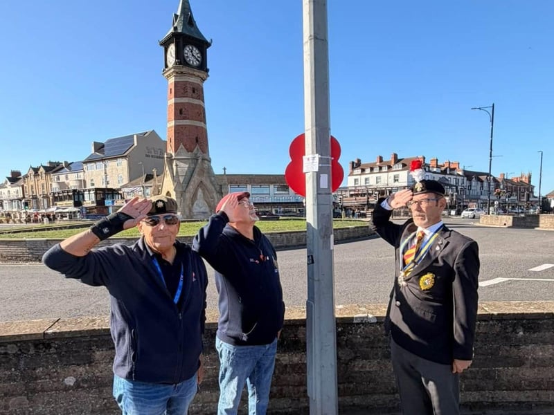RBL branch chairman Kevin Woolley, right, with fellow veterans after installing sponsored poppies on lampposts in Skegness.
