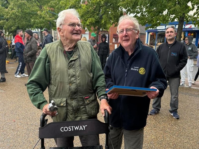 John Wildman (left). of Wildmans Motorcycles shop in Spilsby, who received a certificate from Spilsby Rotary Club to mark 100 years in business.