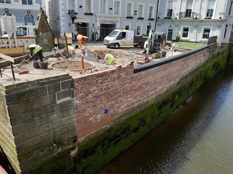 The scene in May with the new wall in place.