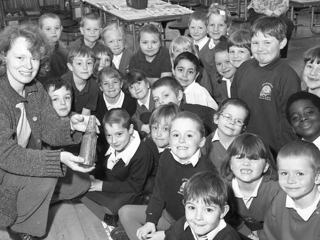 St Mary's RC Primary School, Swineshead, playing host to community archaeologist Susan Smith. The youngsters were shown artefacts, including bottles from Boston's Guildhall Museum, and, afterwards, recreated a dig with objects hidden in sand trays.