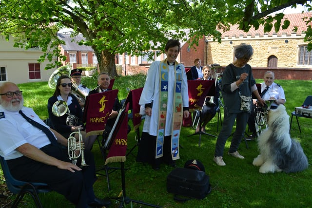 The Rev Catherine Wylie with Dotty and her owner Sue, and members of Market Rasen Salvation Army Band who provided the music at the Pet Service