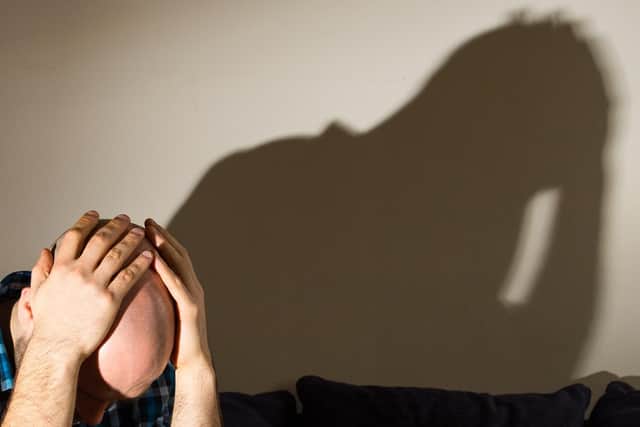 PICTURE POSED BY MODEL A man showing signs of depression.