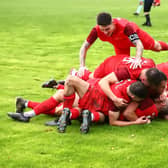 Sleaford celebrate their third goal at Heanor. Photo: Steve W Davies Photography.