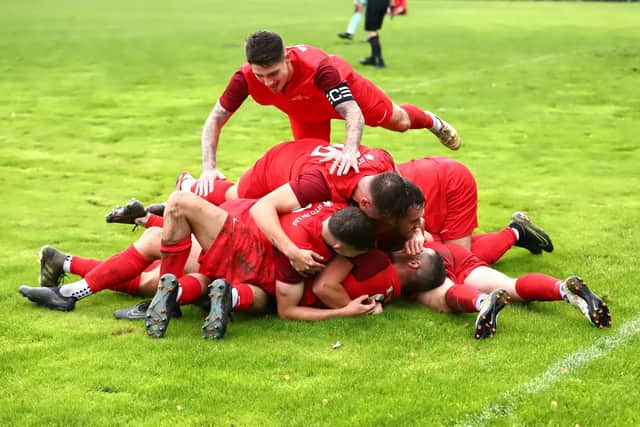 Sleaford celebrate their third goal at Heanor. Photo: Steve W Davies Photography.