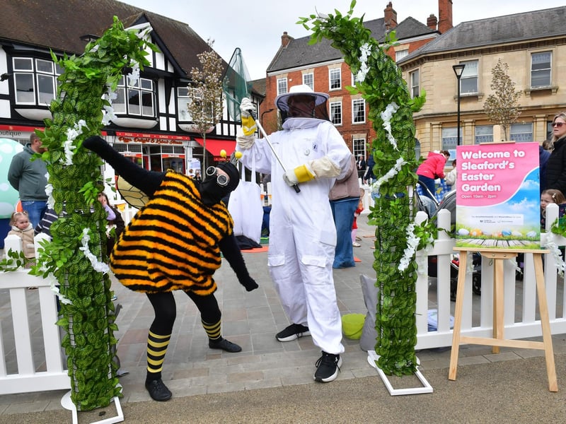 Keeping the atmosphere buzzing - street performers in the Easter Garden at Sleaford Market Place. Photo: David Dawson