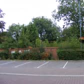 The overgrown garden behind the wall of Money's Yard car park, set to become a new riverside park in the town centre.