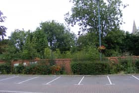 The overgrown garden behind the wall of Money's Yard car park, set to become a new riverside park in the town centre.