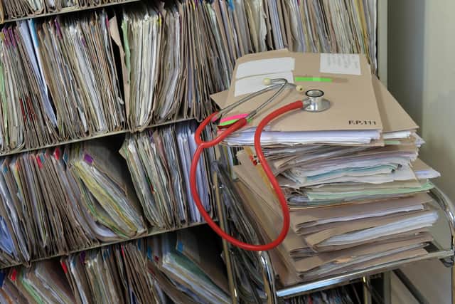 A stethoscope on top of patient's files at the Temple Fortune Health Centre GP Practice near Golders Green, London.