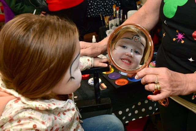 Evie Spry 3 of Sleaford having her first ever face paint. In the Town Hall