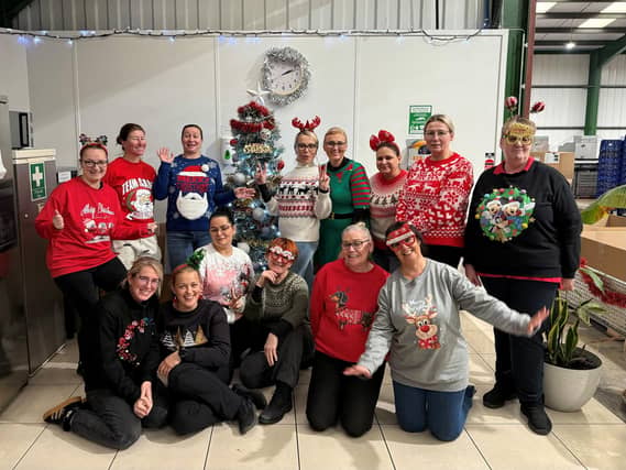 Dynamic Cassette International Ltd. Employees Celebrating National Christmas Jumper Day in honour of Go For It! Charity
