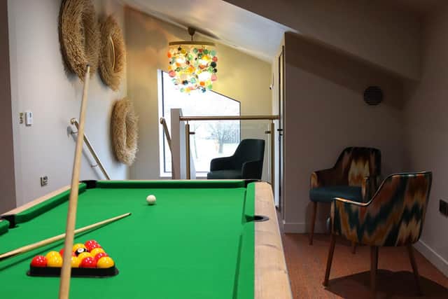 The refurbished games lounge at Bainland Lodge Retreats with a pool table.