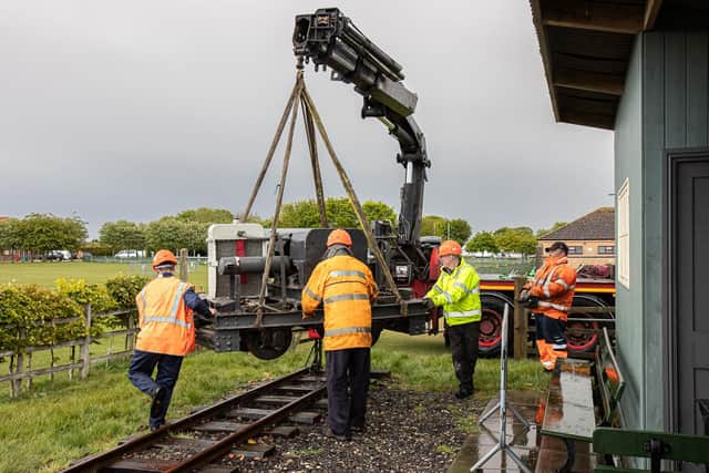 LCLR volunteers guide the historic loco on to the track at Walls Lane station in the Skegness Water Leisure Park after its move from the Imperial War Museum at Duxford (Photo: Dave Enefer/LCLR).
