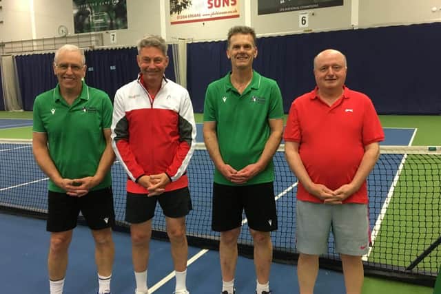 Mike Burnett (second left).