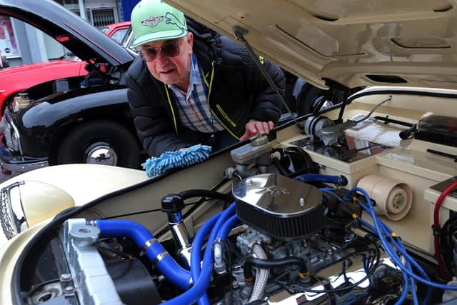 David Snowdon polishes the engine bay of the rare 1983 Panther Kallasta.