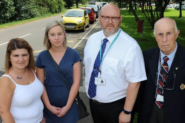 Parents, Kayleigh Kay, left and Kelly Geeson, are joined by head teacher, Gary Brown and Coun. Keith Panter, right, who are supporting their campaign for traffic calming measures outside the Castle Wood Academy in Gainsborough.