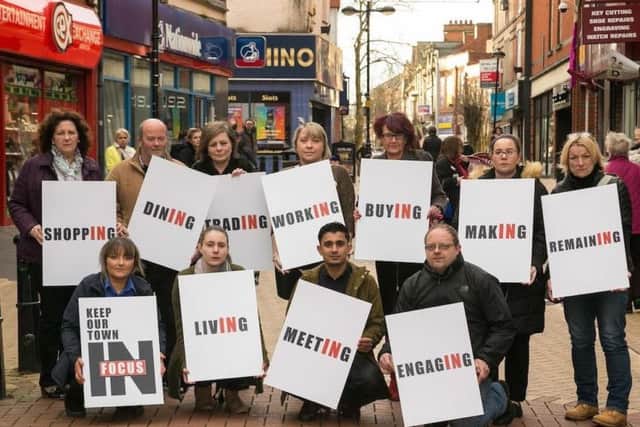 Members of the Keep Our Town in Focus group make their views on a proposed retail park clear.