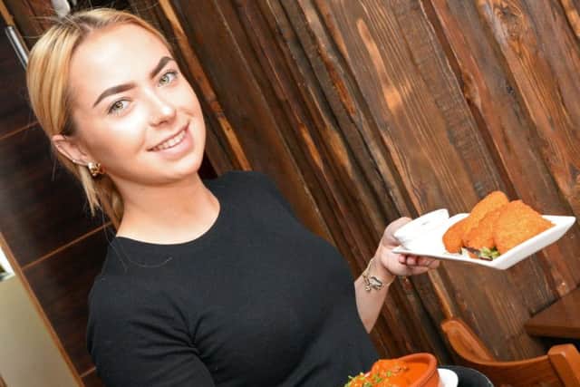 Wiktoria Bonatowska, bartender pictured with a selection of Tapas dishes. Picture: NDFP El Toro MC 3