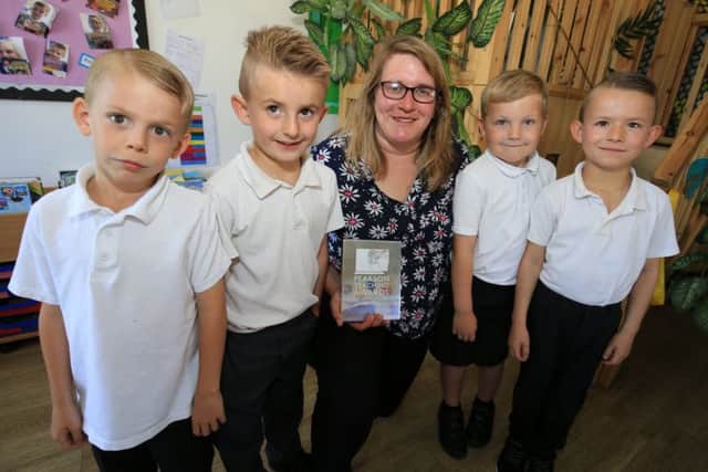 Hillcrest Early Years Academy teacher Laura McDonald has won a Pearson Teaching Award. Laura is pictured with pupils Dominic Stainton, six, Rio Ker, seven, Lucas Caneireo, six, and Logan Caneireo, six.