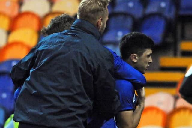 Mansfield Town v Sheffield Wednesday.
Forestieri is shepherded off the pitch.