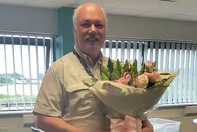 Gainsborough Heritage Society chairman Andrew Birkitt receiving a bouquet of flowers donated by Fabulous Flowers (on behalf of Gainsborough Life)