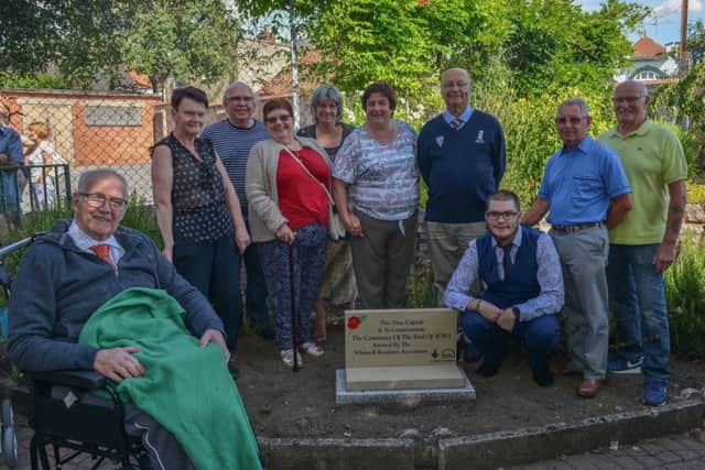 Unveiling of plaque marking the spot of a time capsule buried to commemorate the centenary of the end of WW1, picture includes Ken Keeton, Rob Murphy, vice chairman James Wale, Sue Legge, chairman John Green, John Wale, Gwen Court, Coun Viv Mills, Coun Sharlene Wale, and Coun Tom Munro chair of Parish Council