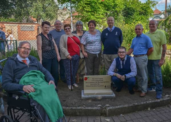 Unveiling of plaque marking the spot of a time capsule buried to commemorate the centenary of the end of WW1, picture includes Ken Keeton, Rob Murphy, vice chairman James Wale, Sue Legge, chairman John Green, John Wale, Gwen Court, Coun Viv Mills, Coun Sharlene Wale, and Coun Tom Munro chair of Parish Council