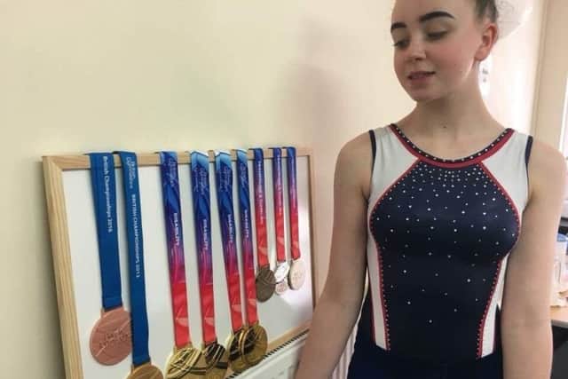 Gymnast Lauren Douce with her collection of medals,