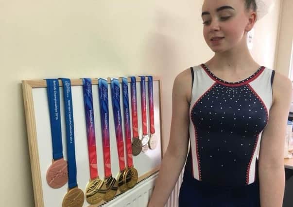 Gymnast Lauren Douce with her collection of medals,