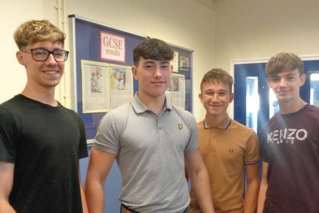 Students from Queen Elizabeth's High School collect their GCSE results