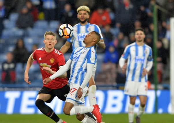 Rajiv van La Parra holds the ball frm Scott McTominay. Huddersfield Town v Manchester United.  Emirates FA Cup 5th Round.  John Smiths Stadium. 17 February 2018.  Picture Bruce Rollinson