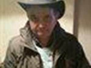 Tony Milson is described as white, medium build, short dark brown hair
