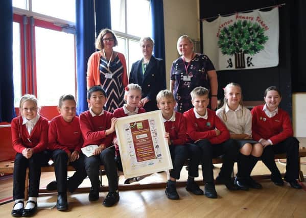 Take Five youngsters at the school with staff and Coun Tracey Taylor, of Nottinghamshire County Council.
