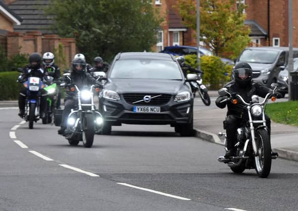 Bikers escort the hearse of Ian Cartlidge.