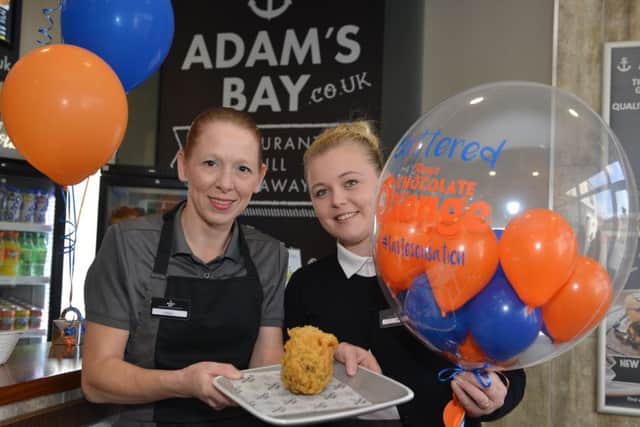 Vicky Gardener and Jade Hearn with a serving of battered chocolate orange at Adams Bay in Gainsborough.