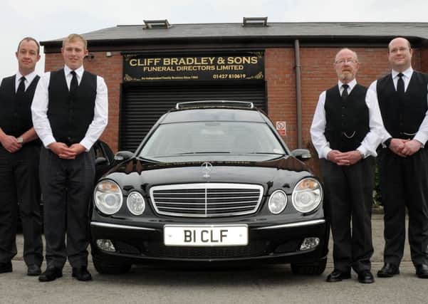 Carlton Bradley (right) with three other key figures at Cliff Bradley and Sons, from left, Mannie Bradley, Edward Kliszcz and Cliff Bradley. (PHOTO BY: Andrew Roe)