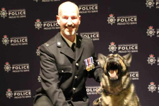 Former police dog Grace with her handler, PC Gregor Robbie.