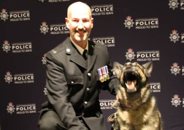 Former police dog Grace with her handler, PC Gregor Robbie.