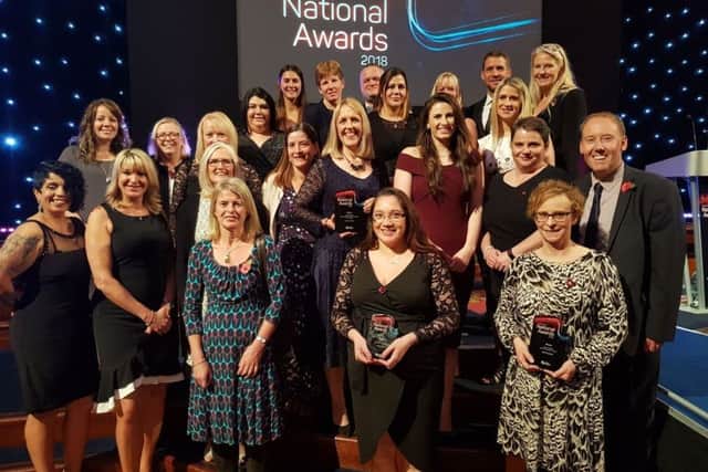 The full Everyone Active team with their Swim England award.