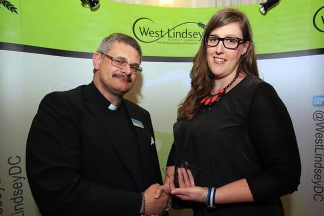 Lizzie Jordan receives her district champion of the year award last year from Coun David Cotton.