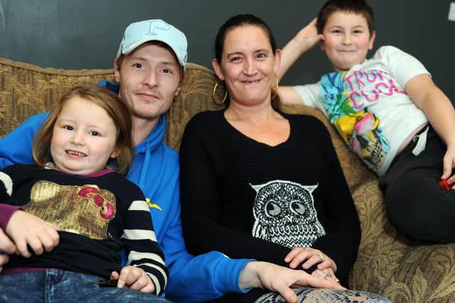 Tammie and Nathaniel with children, Kacey, 4 and Kai 9, in their new home on Stanley Street.