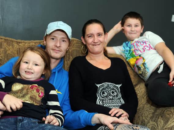 Tammie and Nathaniel with children, Kacey, 4 and Kai 9, in their new home on Stanley Street.