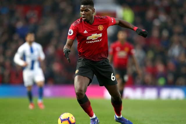 MANCHESTER, ENGLAND - JANUARY 19: Paul Pogba of Manchester United runs with the ball during the Premier League match between Manchester United and Brighton & Hove Albion at Old Trafford on January 19, 2019 in Manchester, United Kingdom. (Photo by Jan Kruger/Getty Images)