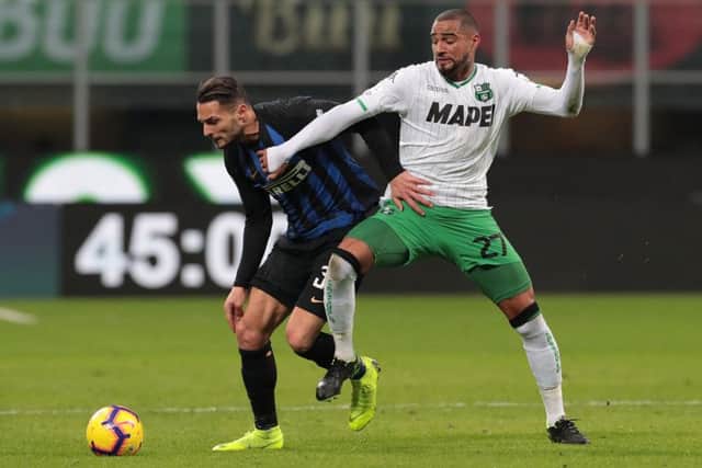 Kevin Prince Boateng (R) in action for US Sassuolo. (Photo by Emilio Andreoli/Getty Images)