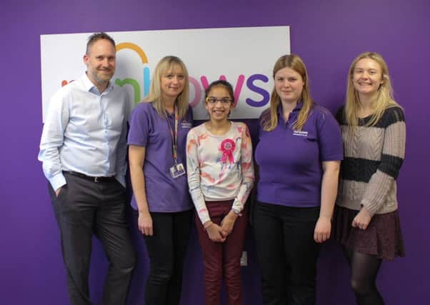 Staff from Rainbows with fundraiser Eesha Verma, from left: Andrew Ball, Ali Furlong, Eesha Verma, Jess Dixon and Emily Wright.