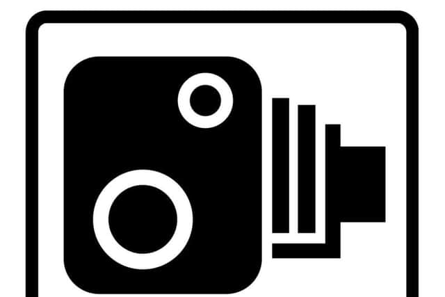 The classic speed camera warning sign